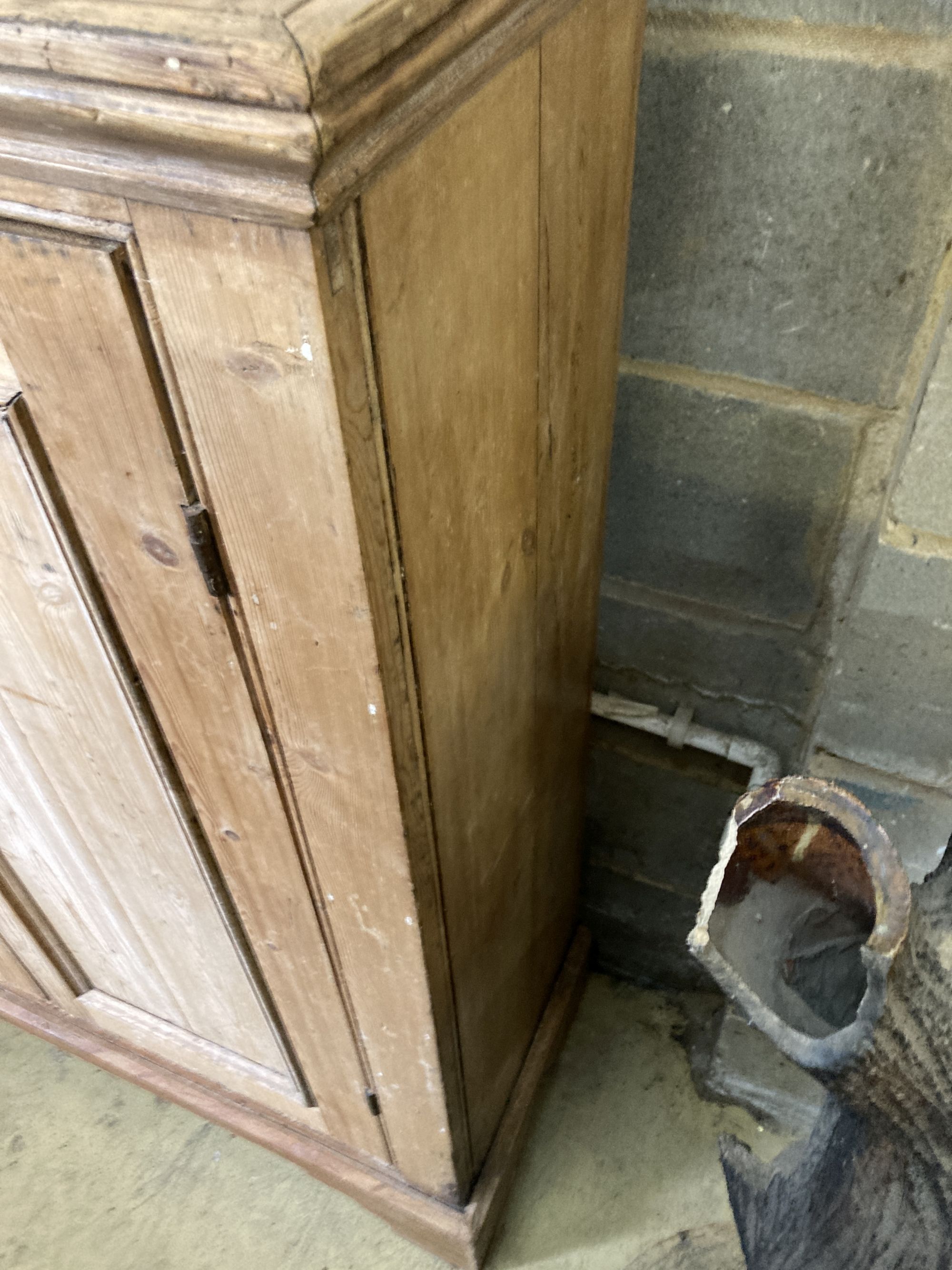 A Victorian pine two door cabinet, width 109cm, depth 37cm, height 127cm